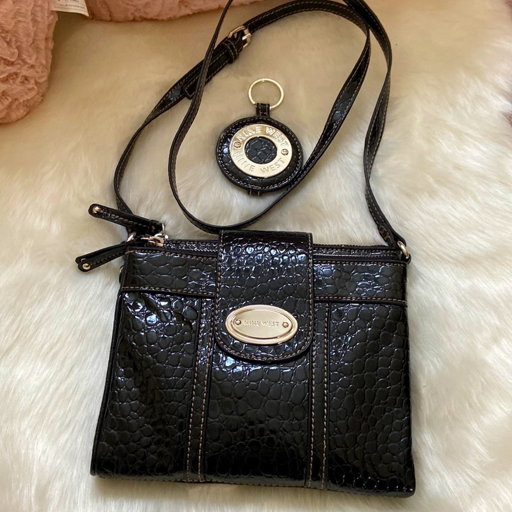 Nine West black crocodile pattern handbag.